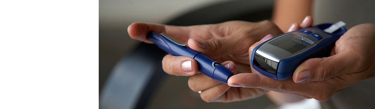 Person doing a diabetes finger prick test