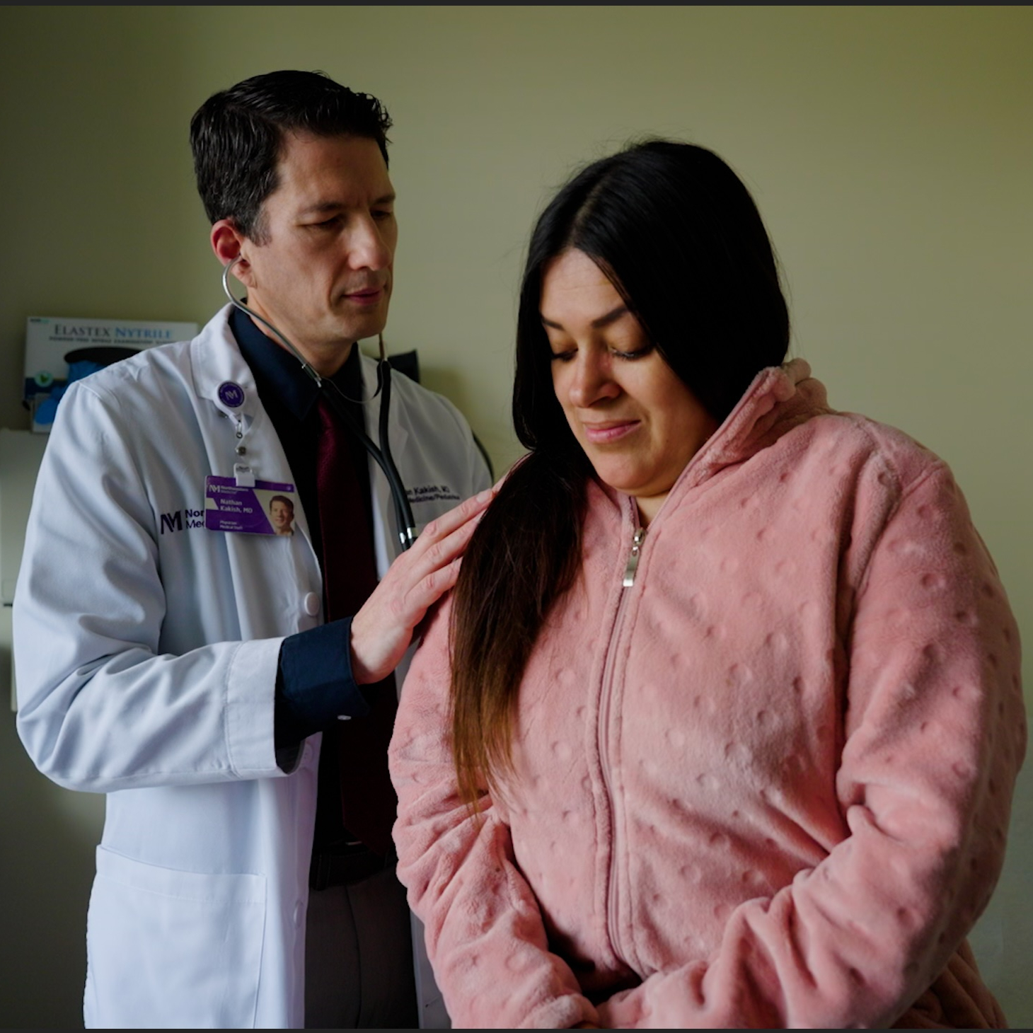 Physician examining a patient