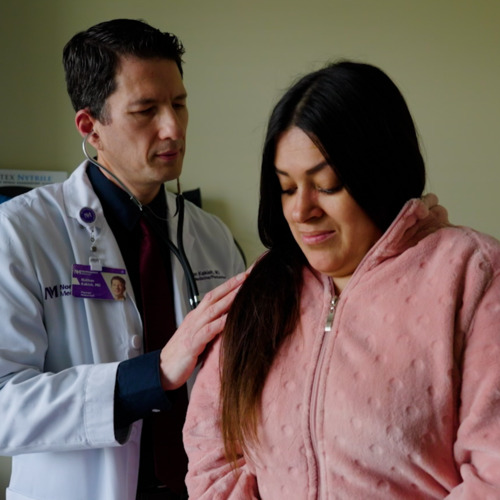 Physician examining a patient
