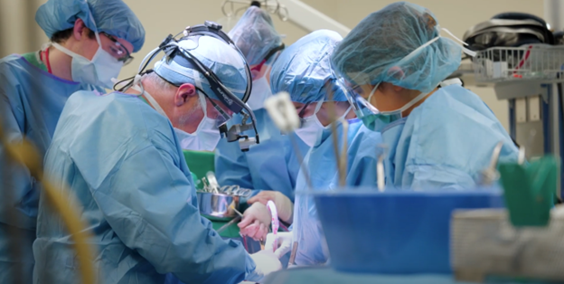 Physicians and care team performing surgery