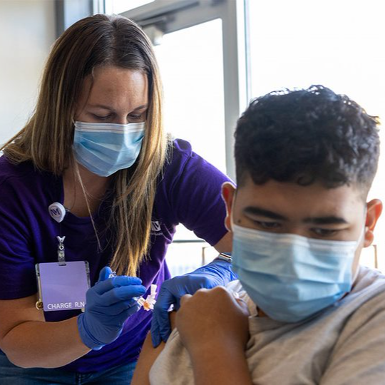 A nurse and patient at a flu clinic
