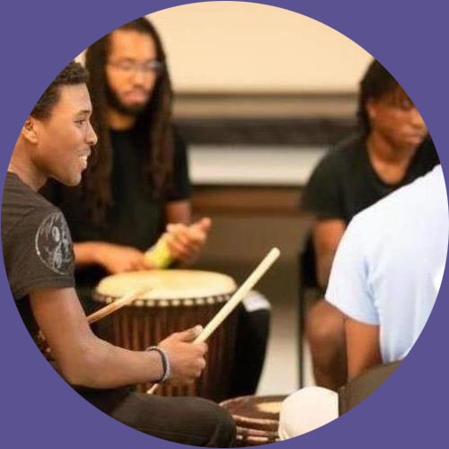 Young black men drumming