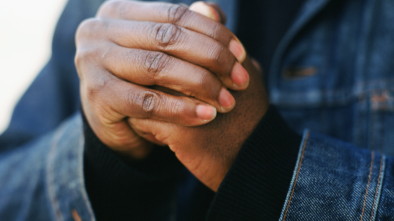 Person cracking their knuckles.