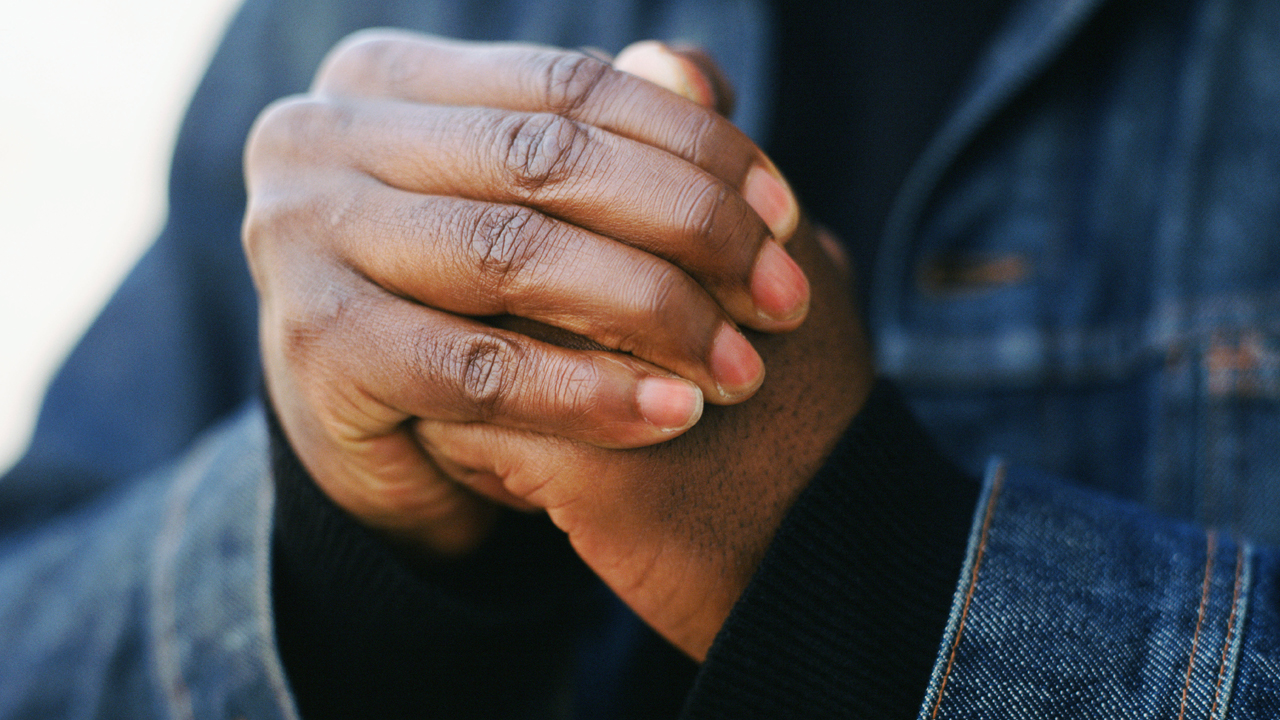 Person cracking their knuckles.