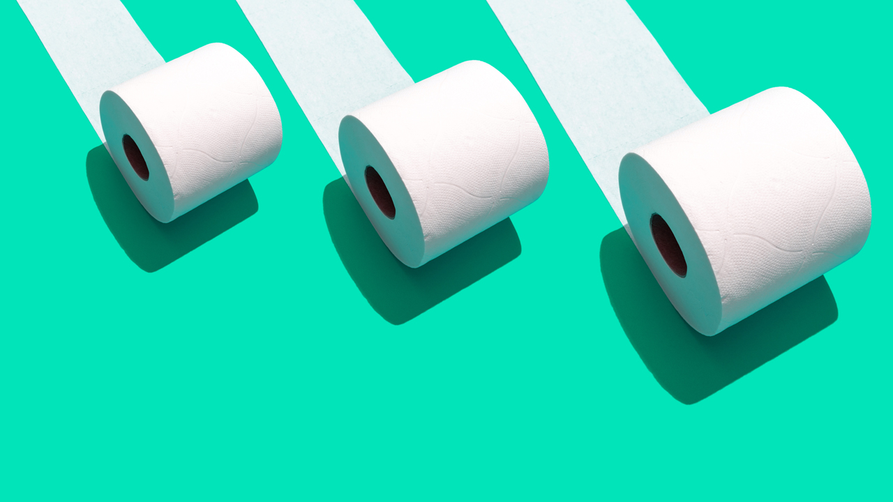 Illustration of three white toilet paper rolls on a green background.