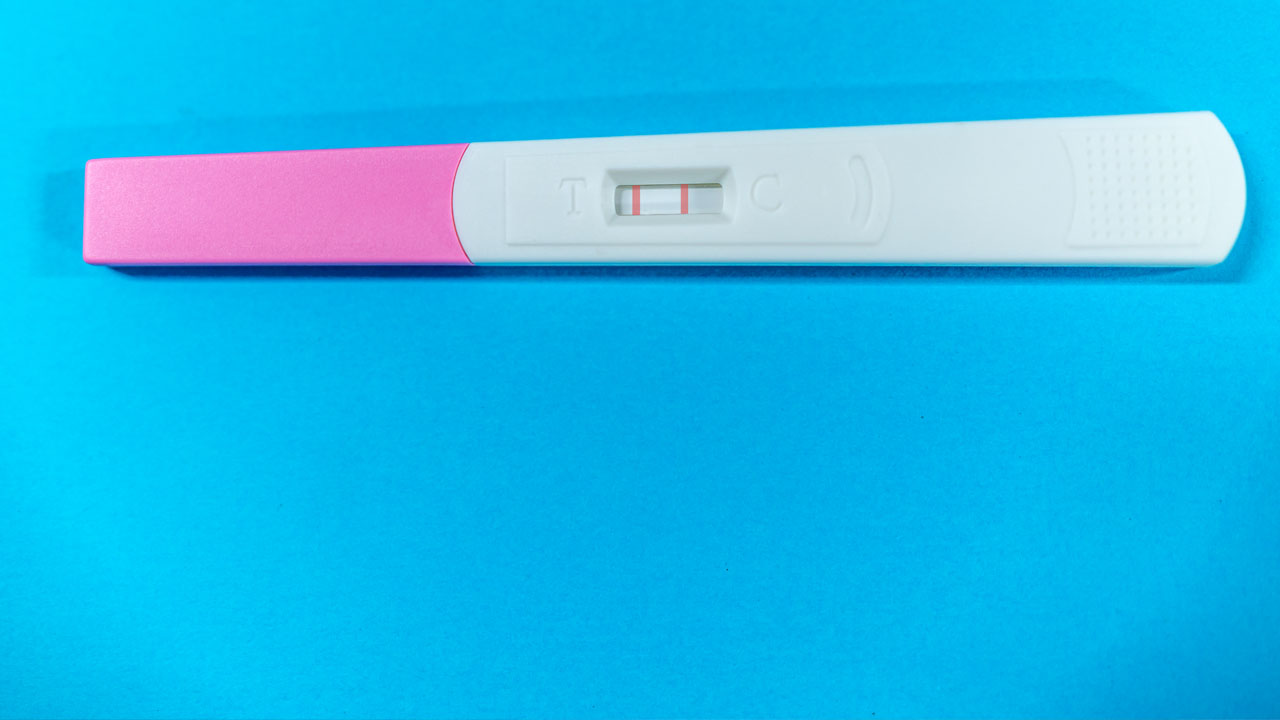 Pregnancy test on a blue background. 