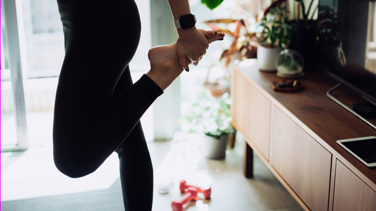 Close up and low section of a person exercising.