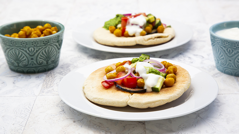 Chickpea gyros with vegetables and tzatziki sauce.