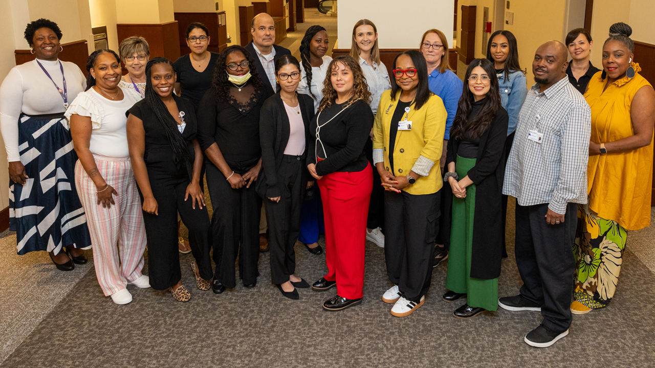 Members of the Northwestern Medicine Outreach Team smile for a group photo.