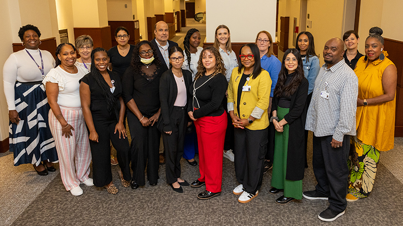 Members of the Northwestern Medicine Outreach Team smile for a group photo.