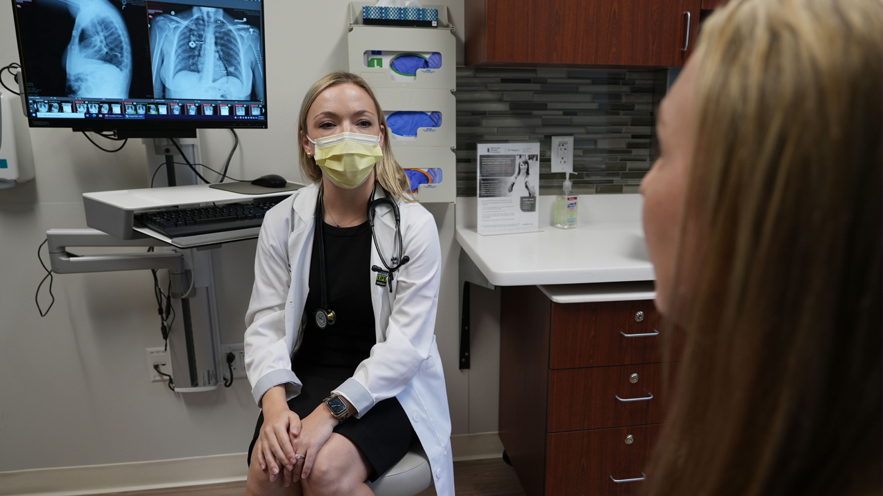 Mandy Wilk and Catherine N. Myers, MD with lung X-rays.