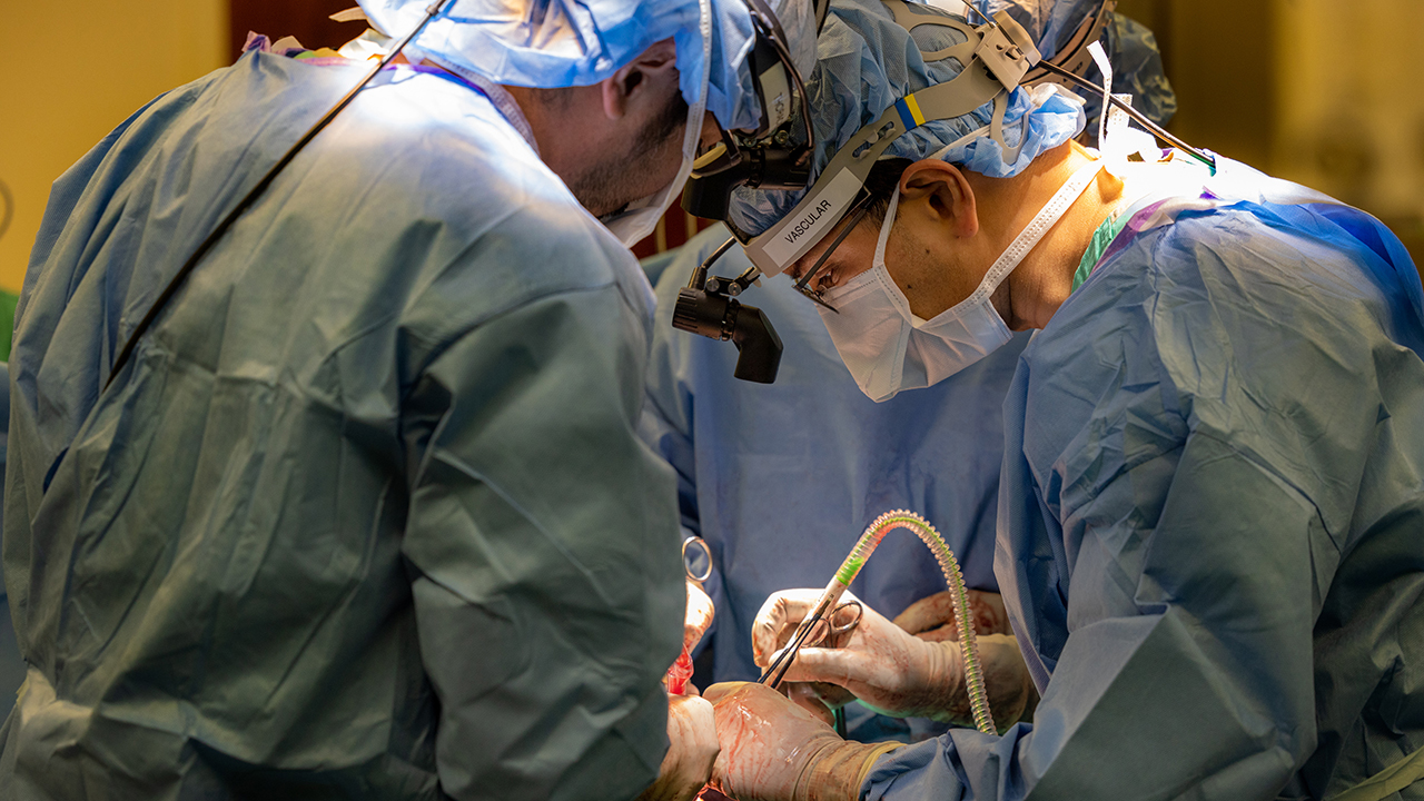 Dr. Chitaru Kurihara and Dr. Ankit Bharat performing surgery.
