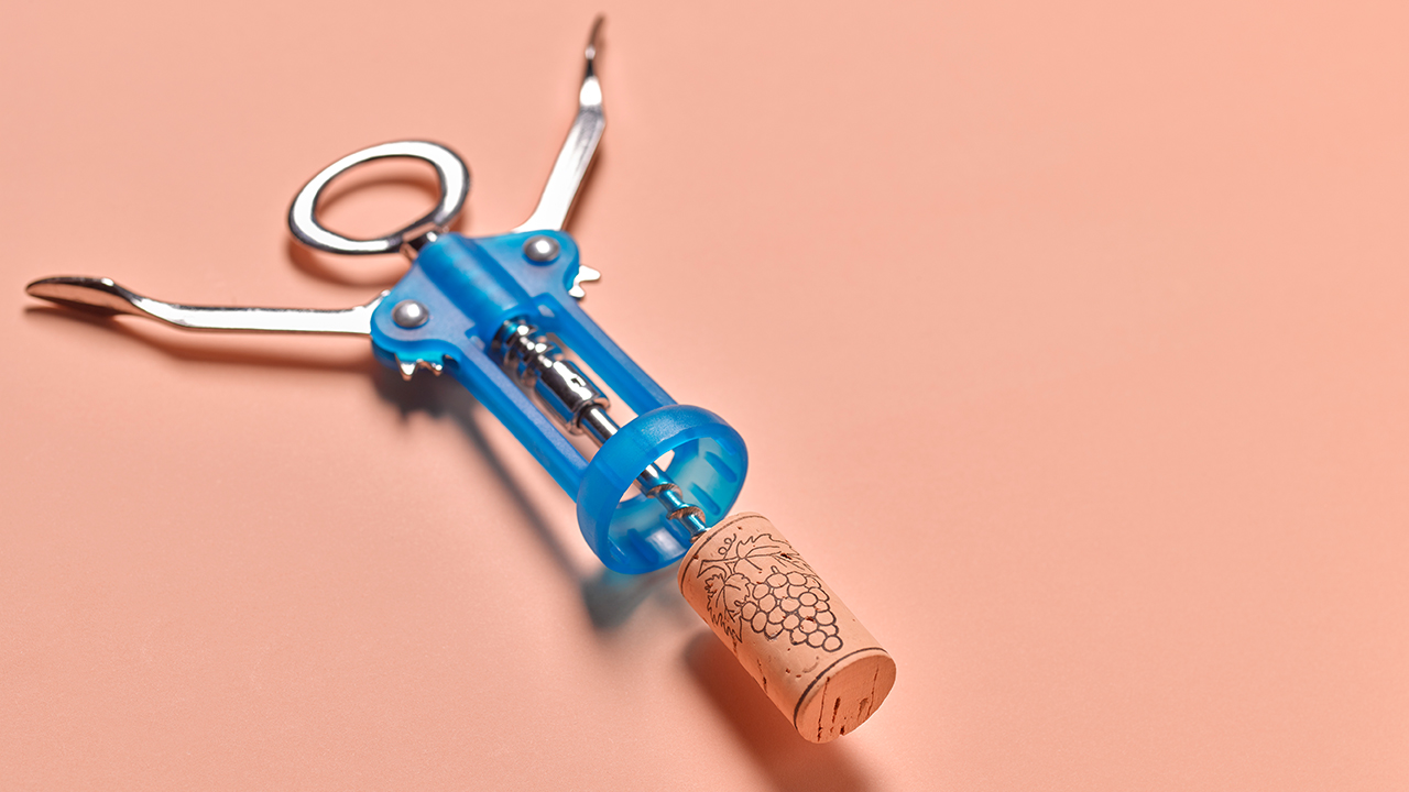 Blue corkscrew on a peach background.