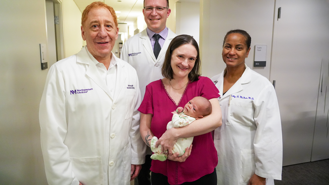 Chelsea Cheveria holds her daughter, surrounded by individuals from her care team, Keith Benzuly, MD, Daniel Schimmel, MD, and Robbye McNair, MD. 