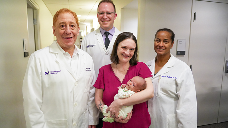 Chelsea Cheveria holds her daughter, surrounded by individuals from her care team, Keith Benzuly, MD, Daniel Schimmel, MD, and Robbye McNair, MD. 