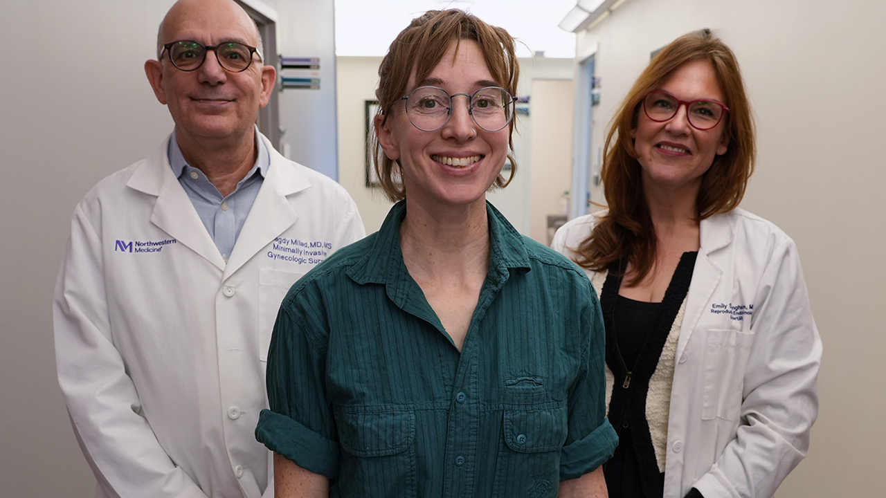 Iona Woolmington standing between Dr. Milad and Dr. Jungheim.