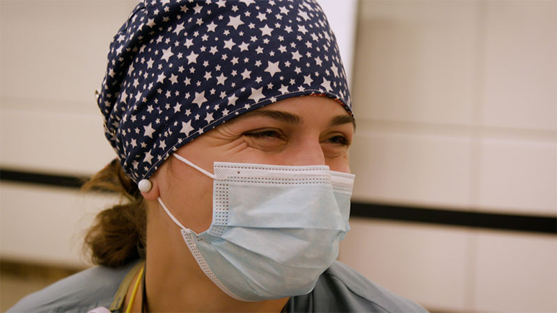 Sara Ruble, smiling behind her face mask
