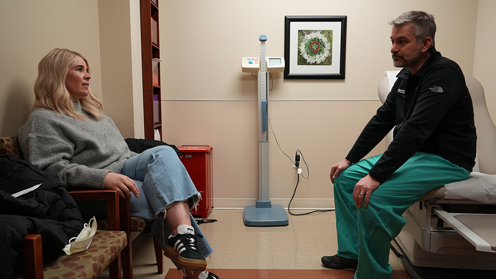 patient and doctor in clinical setting.