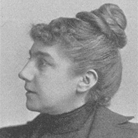Black and white headshot of Maria J. Mergler, MD. She is a white woman with brown hair worn in a bun on top.