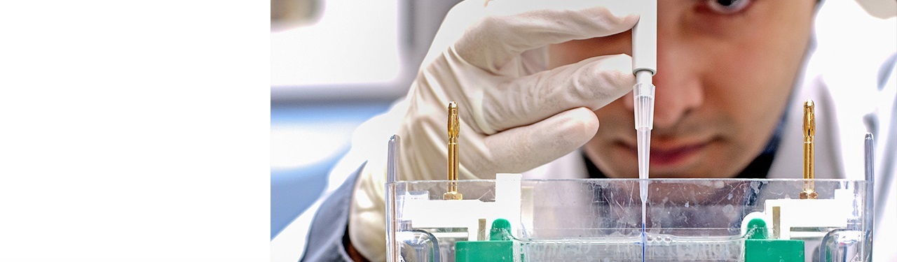 A Northwestern Medicine scientist conducting cancer research with a fine needle.