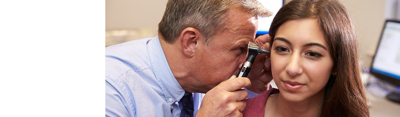 A doctor analyzing a patient's ear