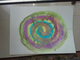 Child's drawing of a colored spiral