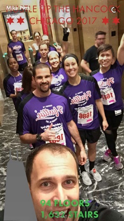 Northwestern Medicine participants smile during the Hustle up the Handcock race