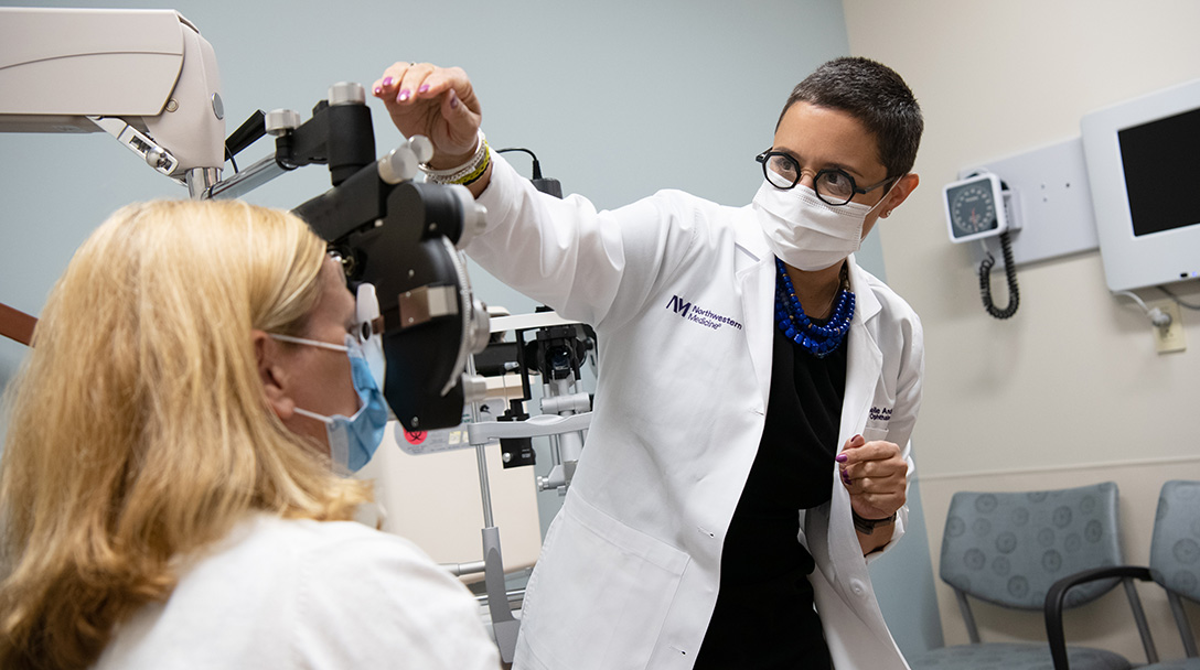 Dr. Michelle Andreoli, Northwestern Medicine RMG Ophthalmologist, conducts an eye exam in Naperville