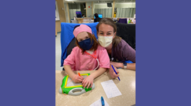 Pediatric cancer survivor Averie Lazzara shares a special bond with nurse Jamie Rogers. 