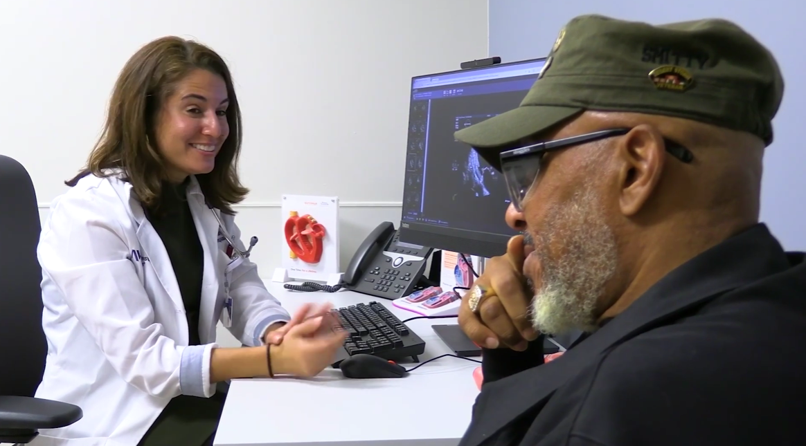 Physician reviewing heart imaging with a patient