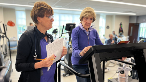Renata Skowronski checks in on patient during cardiac rehab