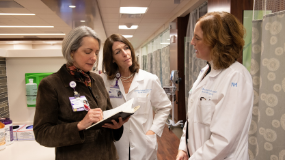 Northwestern Medicine Breast Health Physicians talk together in the hallway