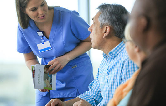 Nurse talking to a group of people