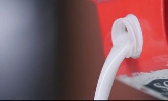 Milk pouring out of carton