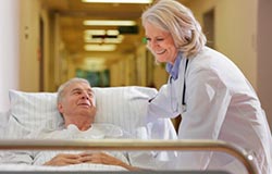 Physician helping senior patient