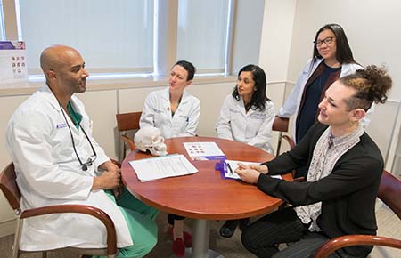 The Northwestern Medicine gender pathways team talking with a patient.