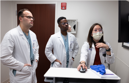 Northwestern Medicine ophthalmology physicians looking at a monitor screen.