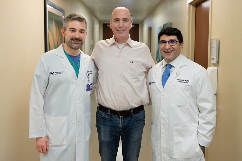 Chicago surgeons standing with a patient in a hallway