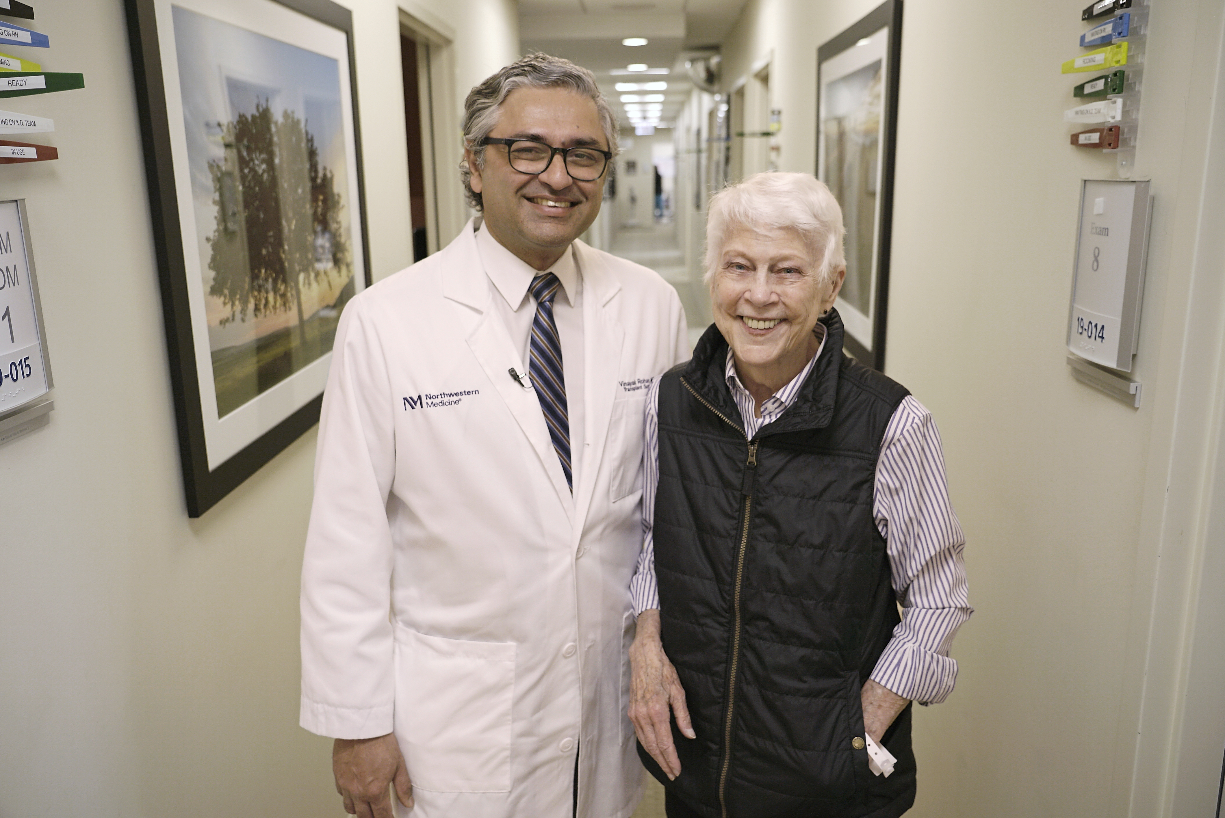 Physician and patient standing together during a follow-up visit in a Northwestern Medicine clinic.