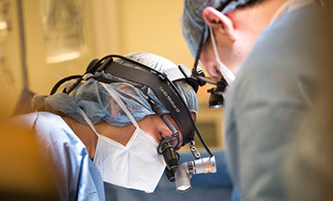 Northwestern Medicine spine surgeons performing surgery on a patient.