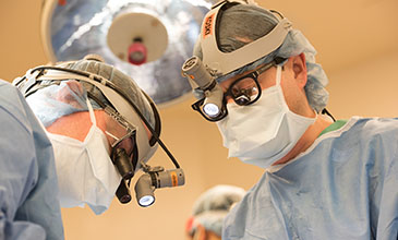 Northwestern Medicine physician Dr. Tyler Koski performing neurosurgery.