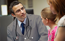 Northwestern Medicine doctor examining young girl