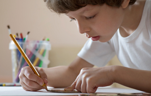 Child concentrating on drawing