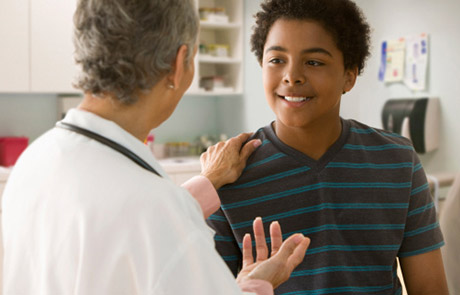 Northwestern Medicine weight management doctor talking to a boy