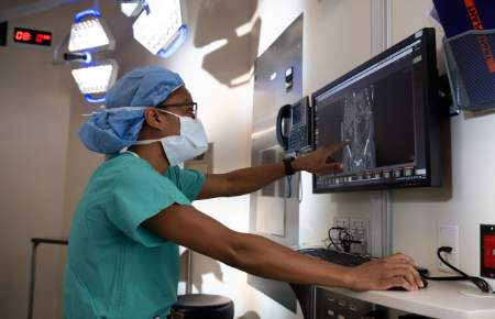 A Northwestern Medicine critical care surgeon reviews a thoracic scan.