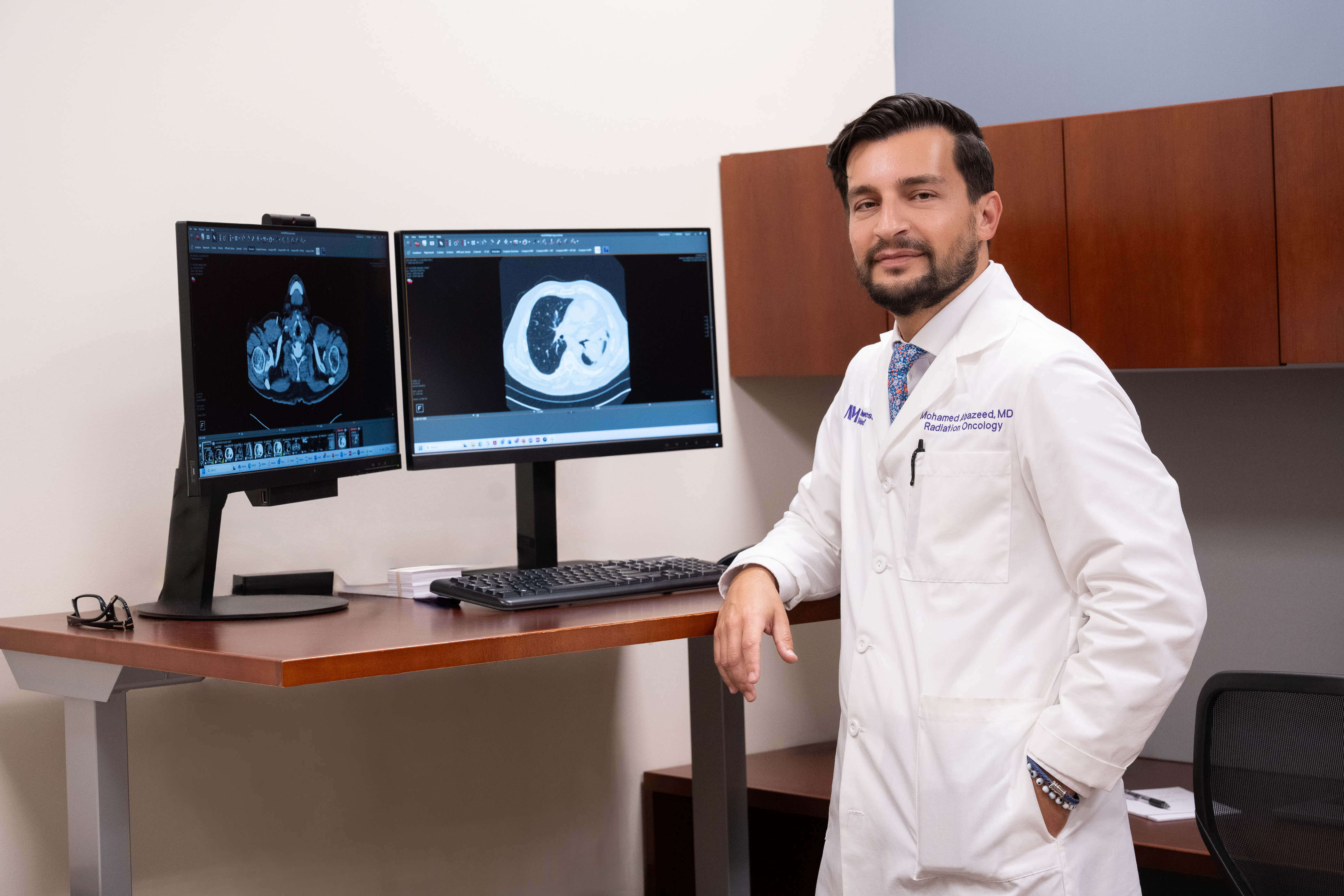 Radiation oncology physician reviewing imaging