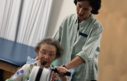 Nurse helping elderly patient