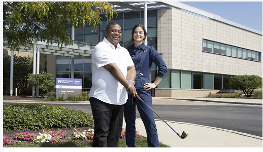 a medical professional outside a hospital with a patient holding a golf club