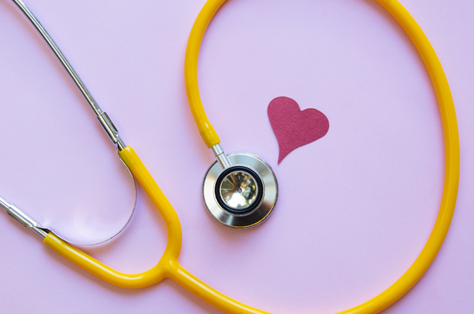 A stethoscope and picture of a heart.