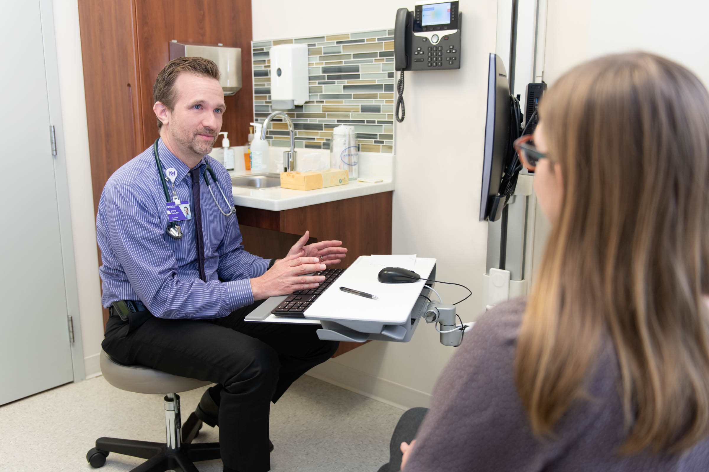 Physician meets with a patient
